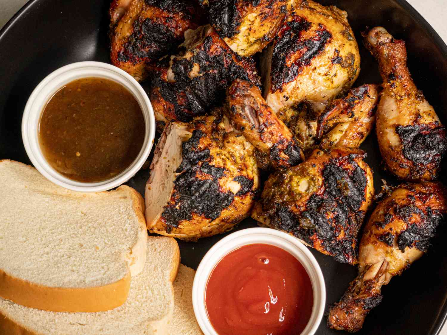 Pan chicken served with white bread and ketchup and Scotch bonnet sauce.