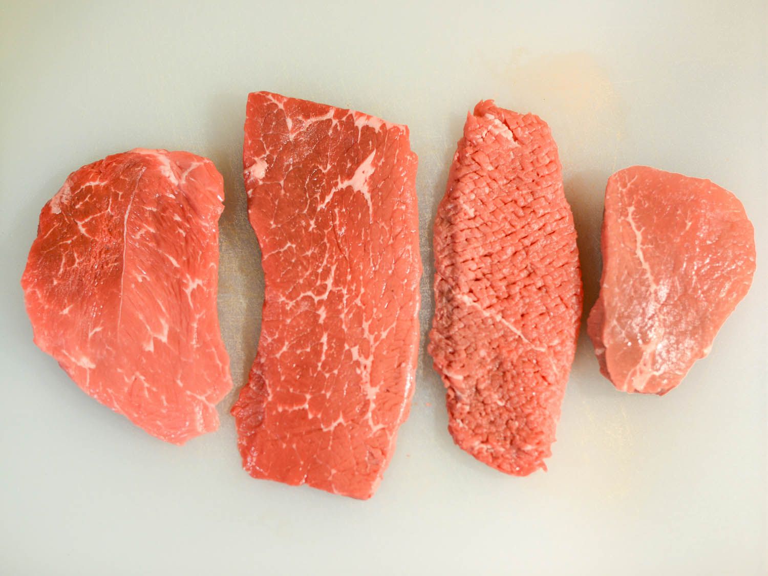 Selecting the best steak for chicken-fried steak, here are four different uncooked steak cuts.
