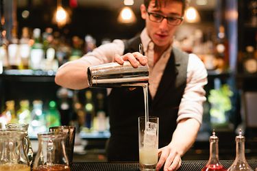 Bartender pouring a cocktail