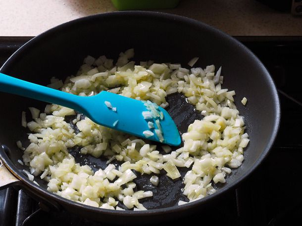 Onions are sautéed in a nonstick skillet.