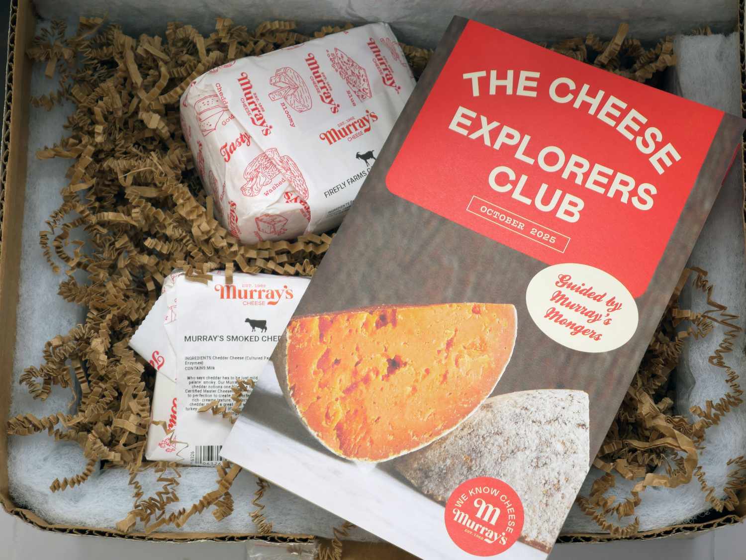 a box with cheese and a pamphlet