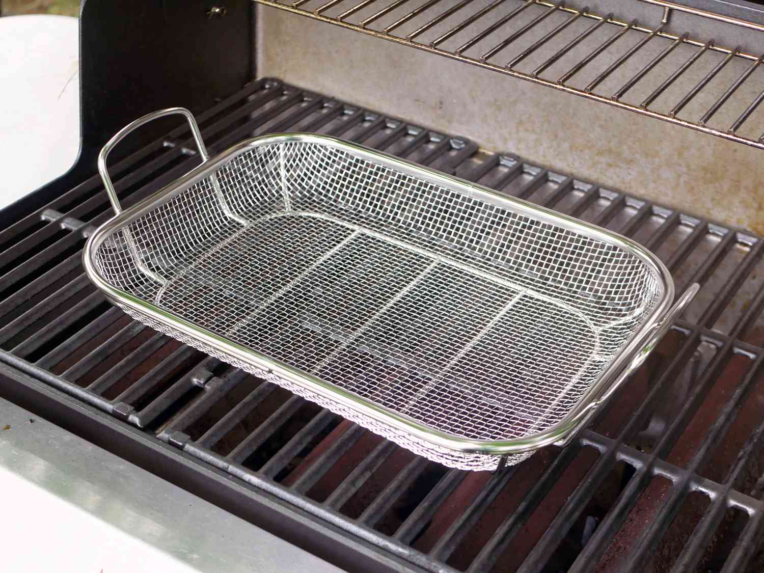 outset grill basket on the grill