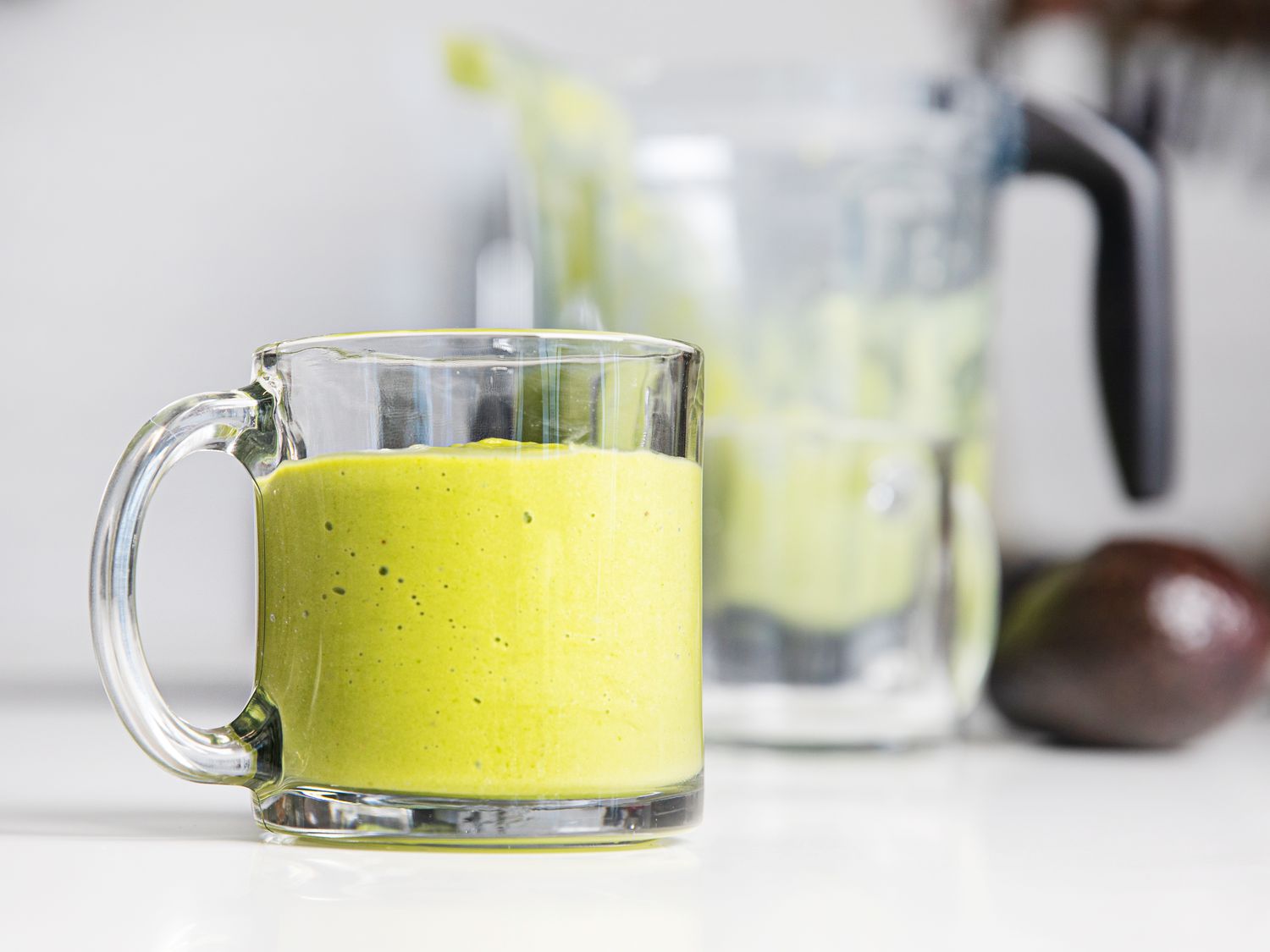 Avocado smoothie in a glass mug