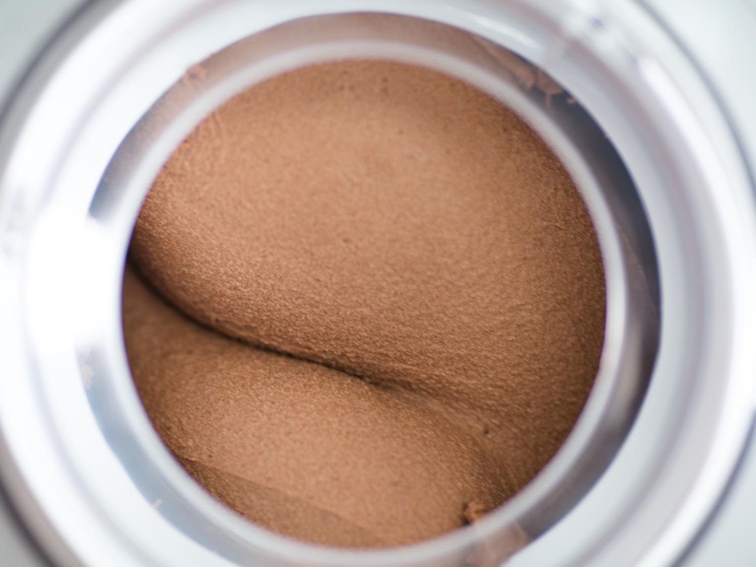 Ice cream being churned in a ice cream machine in a way that makes it look kind of butt-like