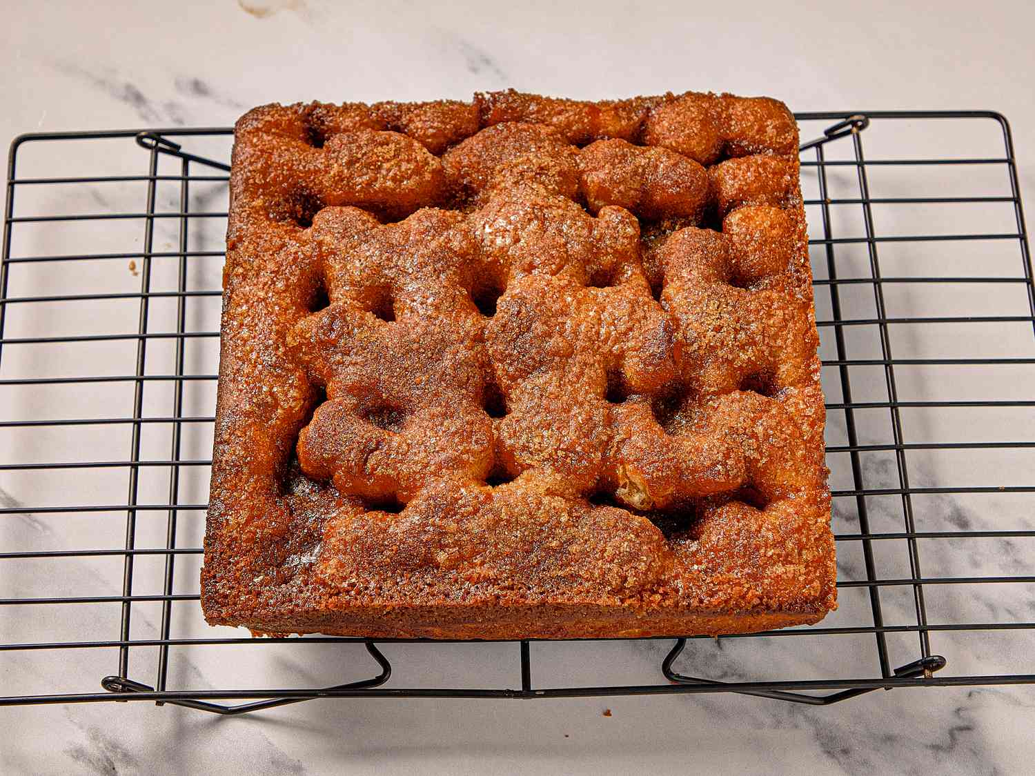 Overhead view of moravian sugar cake on wire rack