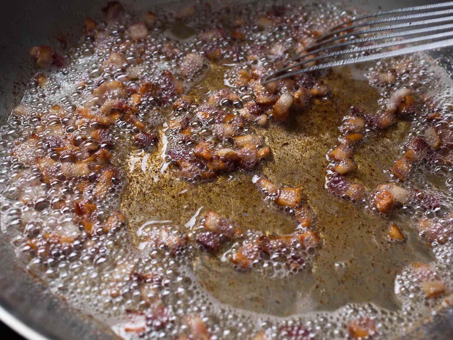 Fat rendered from crisp bacon.