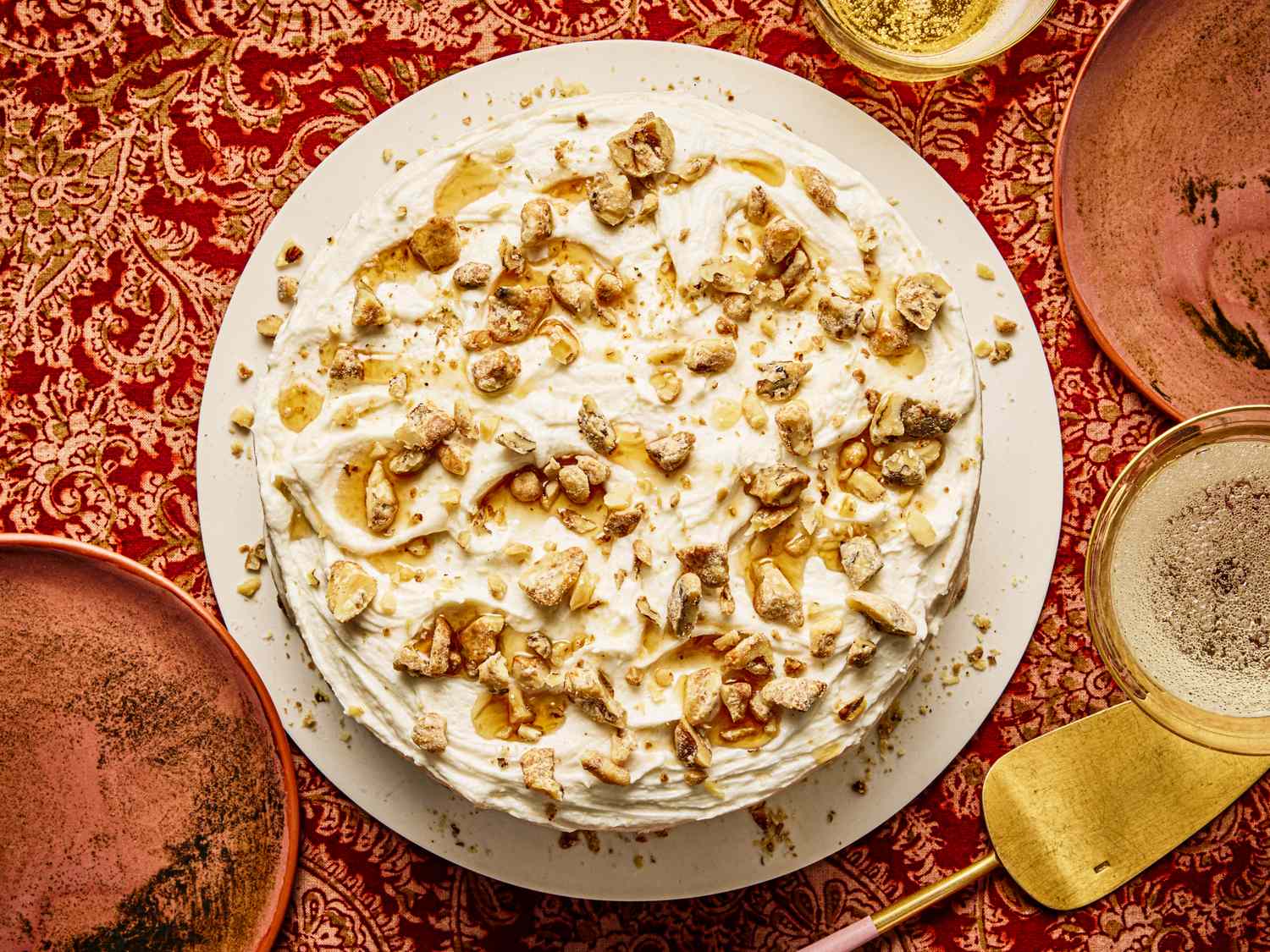 A topped maple walnut cake on a decorated table