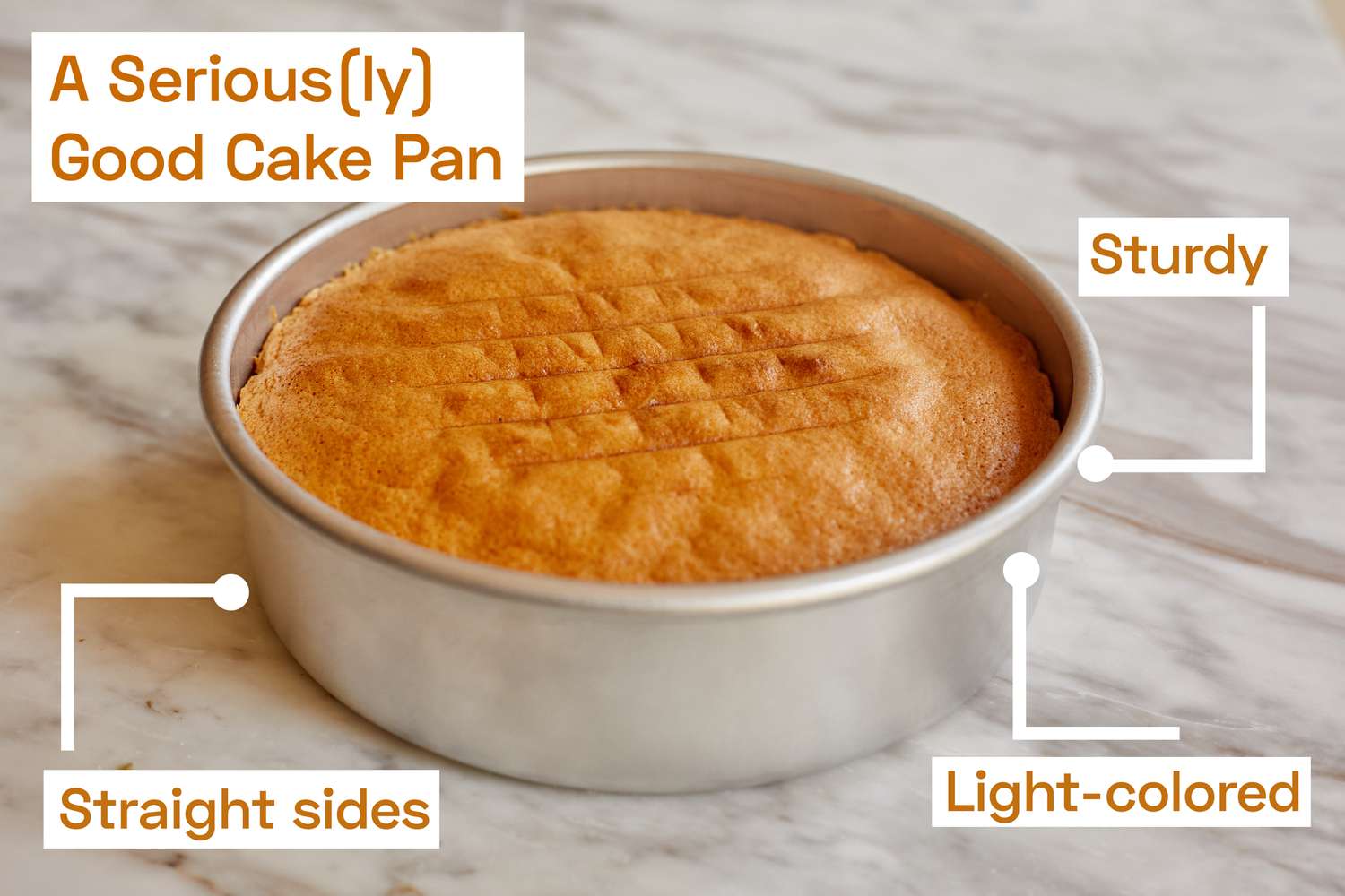 A cake pan with a cake in it on a marble kitchen countertop