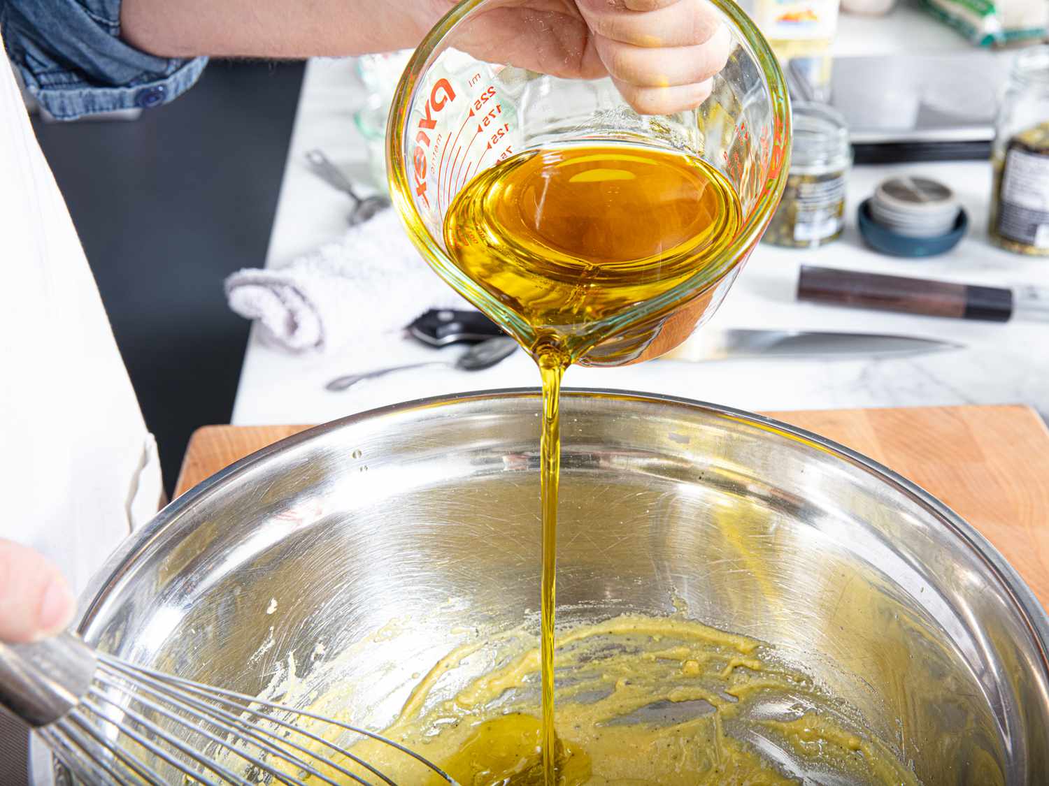 Side view of whisking in oil 