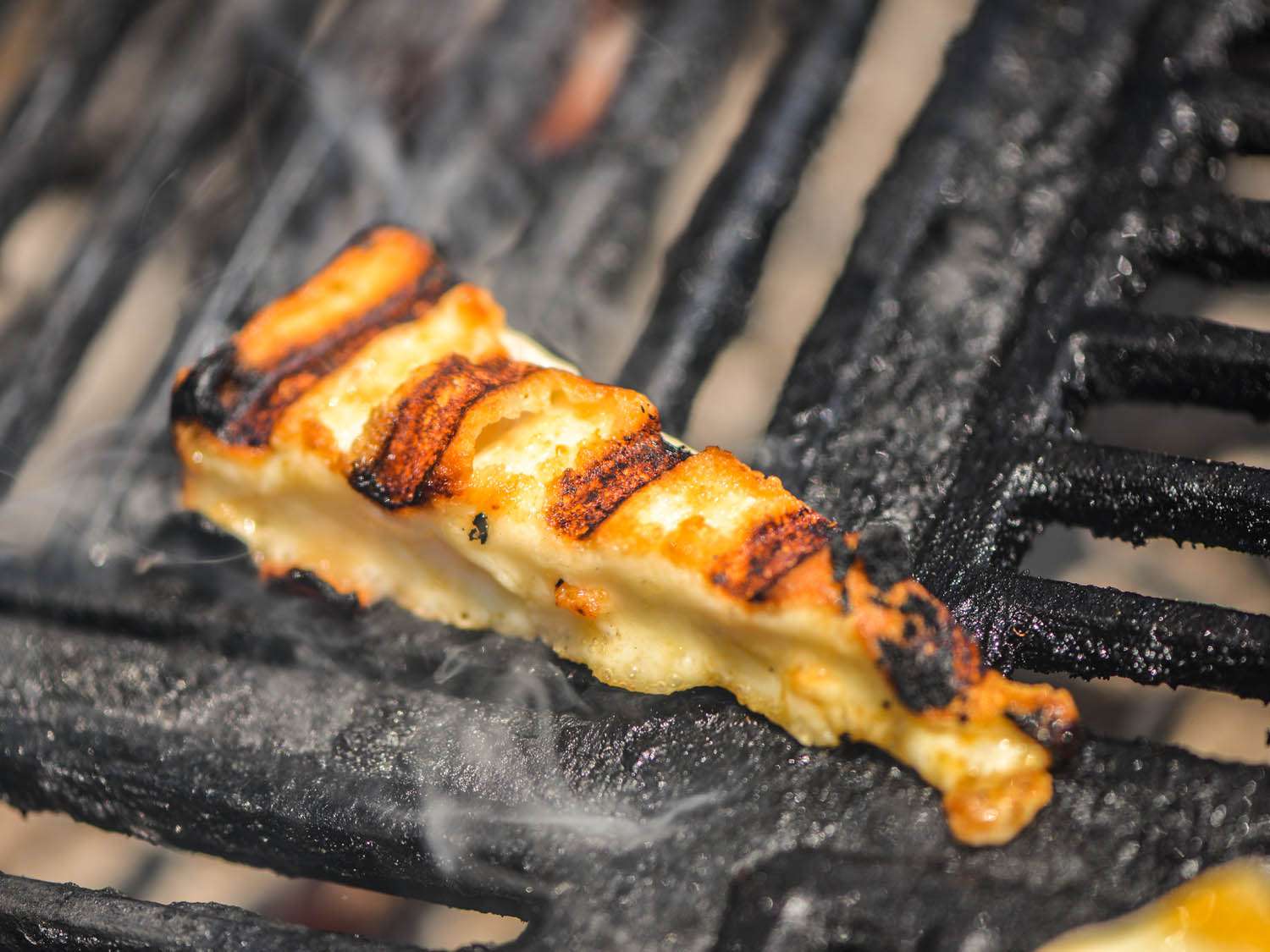 slim wedge of kefalotyri cheese grilled to golden brown