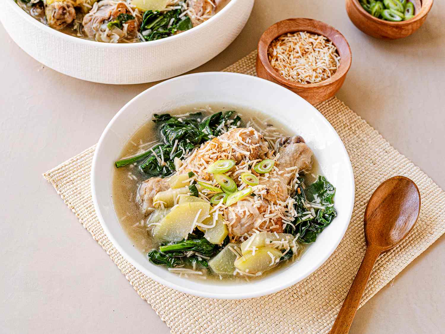 Chicken binakol served in white bowls.