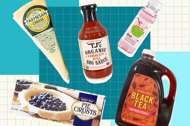 A selection of Trader Joes products including Parmesan cheese barbeque sauce pie crusts black tea and a bottled beverage