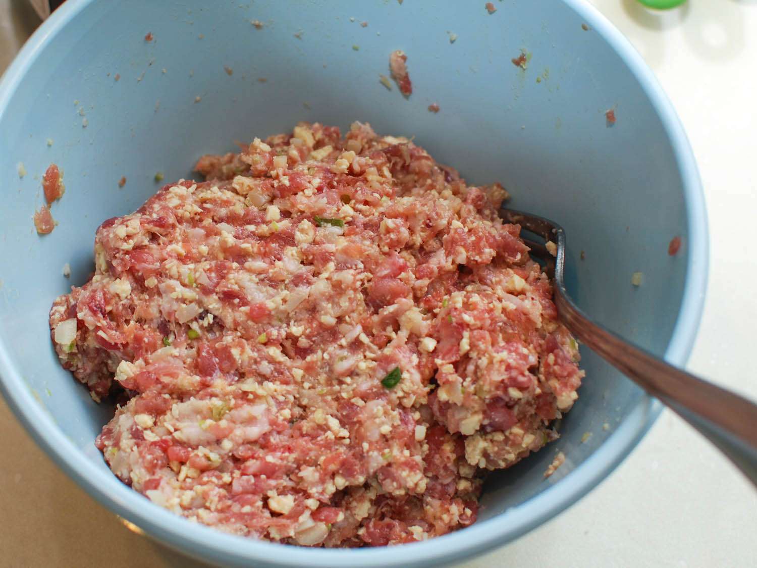 Mixture for lion head's meatballs in a bowl. 
