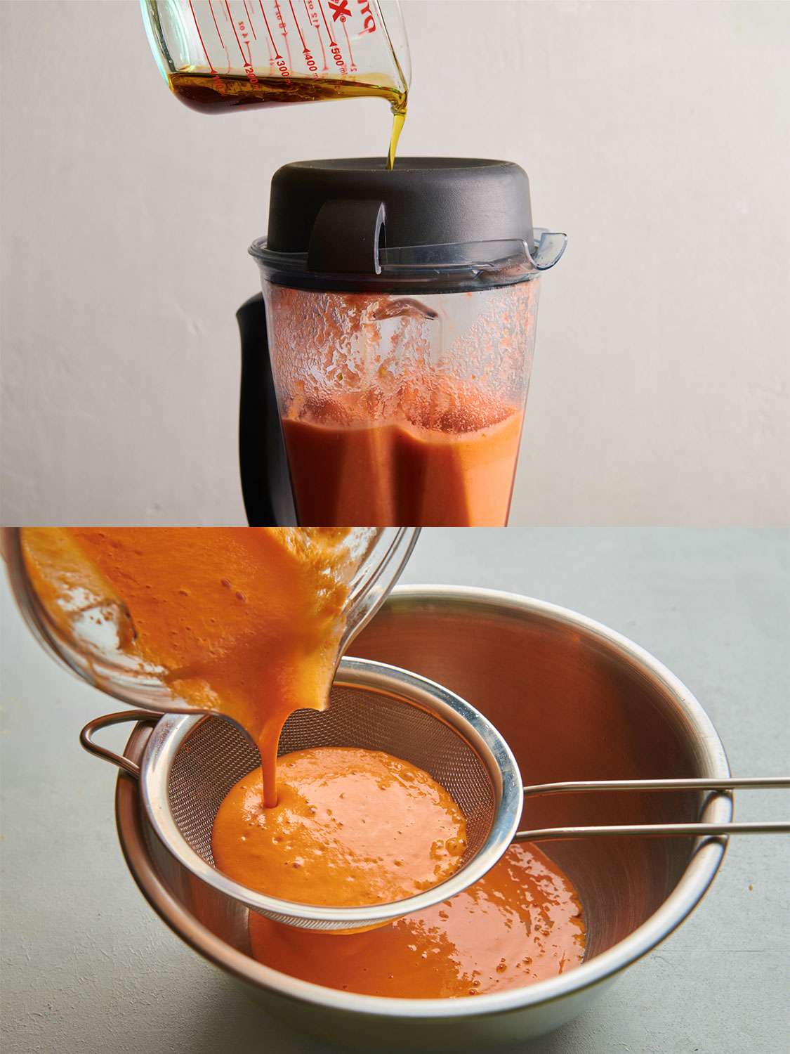 A two-image collage. The top image shows the olive oil and sherry vinegar being slowly drizzled into the jar of a blender which contains the blended vegetables, juices, and bread. The bottom image shows the soup being strained through a fine-mesh strainer into a large bowl.