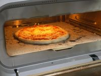a pizza inside a pizza oven