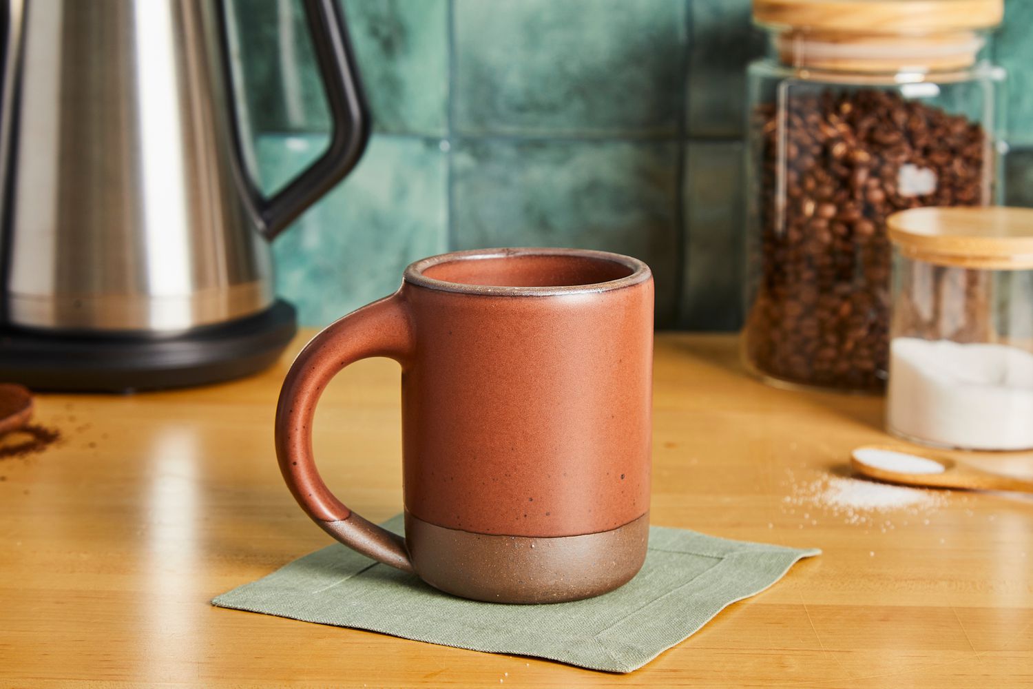A brown East Fork coffee mug on a kitchen countertop.