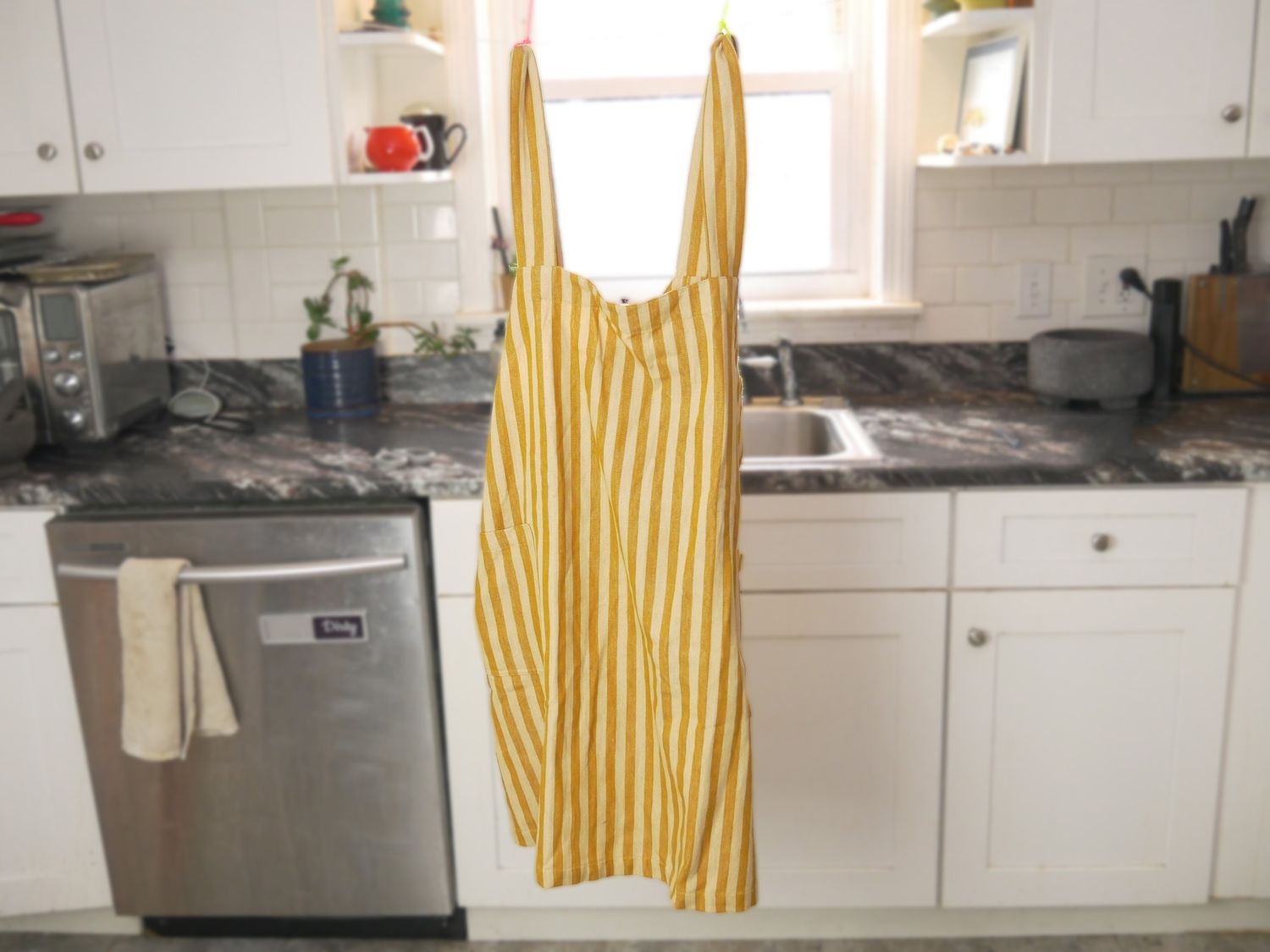 the Minna apron hanging in the kitchen
