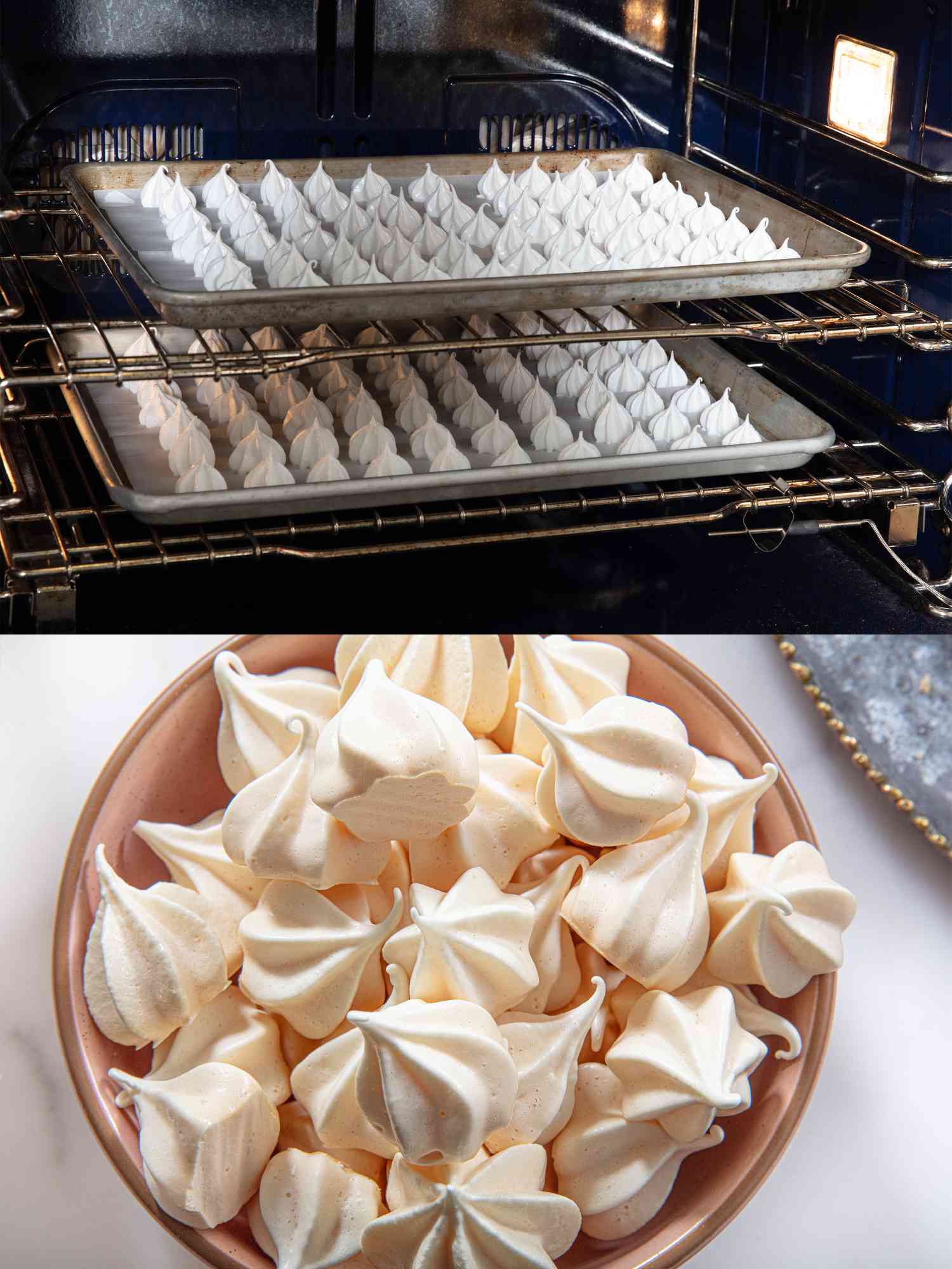 Two baking sheets of meringues in an oven.