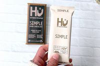 A person holding Hu Simple Dark Chocolate