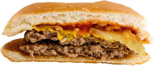 A McDouble cheeseburger cut in half, showing two patties and one slice of cheese. 