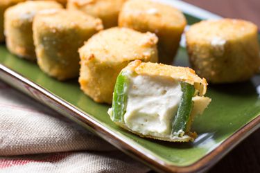 Closeup of crispy deep fried jalapeño poppers.