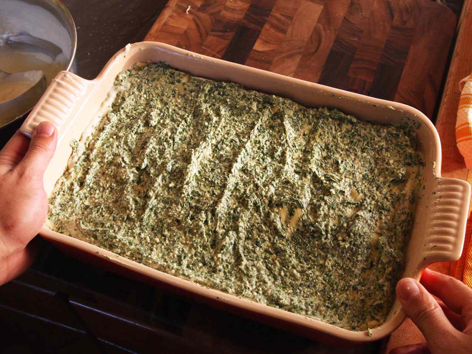 Completed layers of pasta, spinach, and white sauce