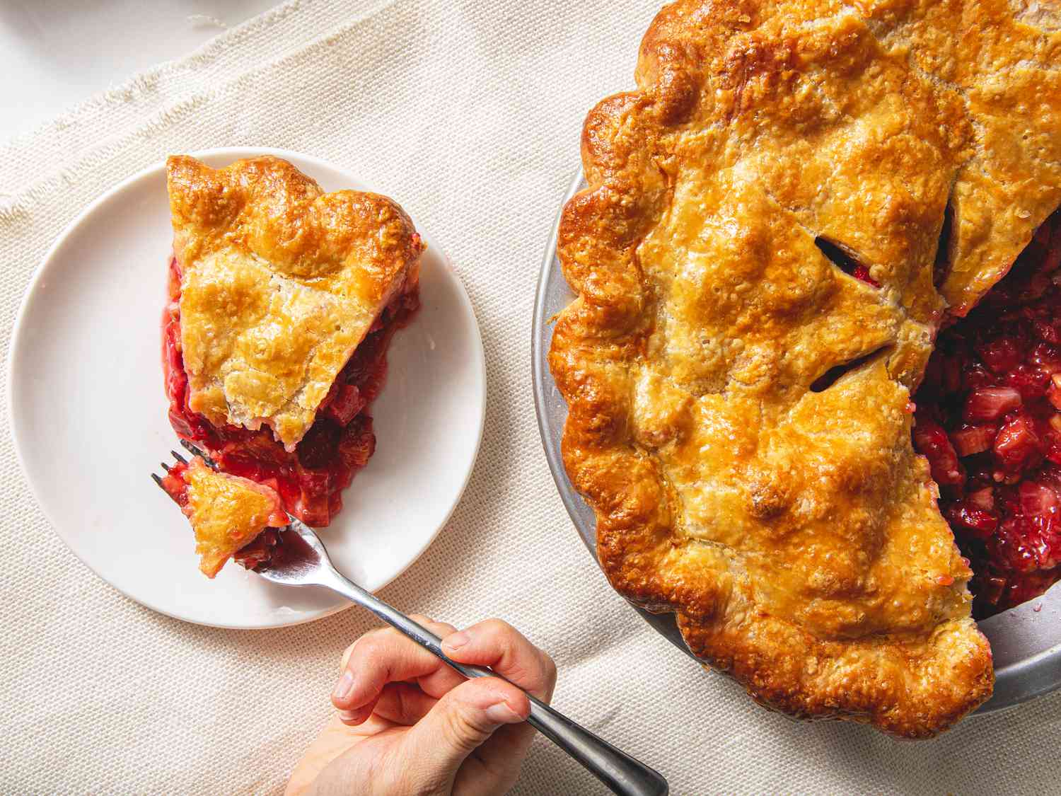 Overhead view of a slice of strawberry-rhubarb pie