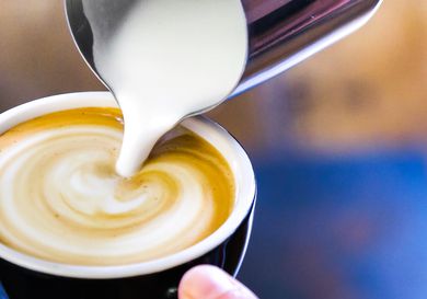 a close up of a latte being made with a non-dairy milk