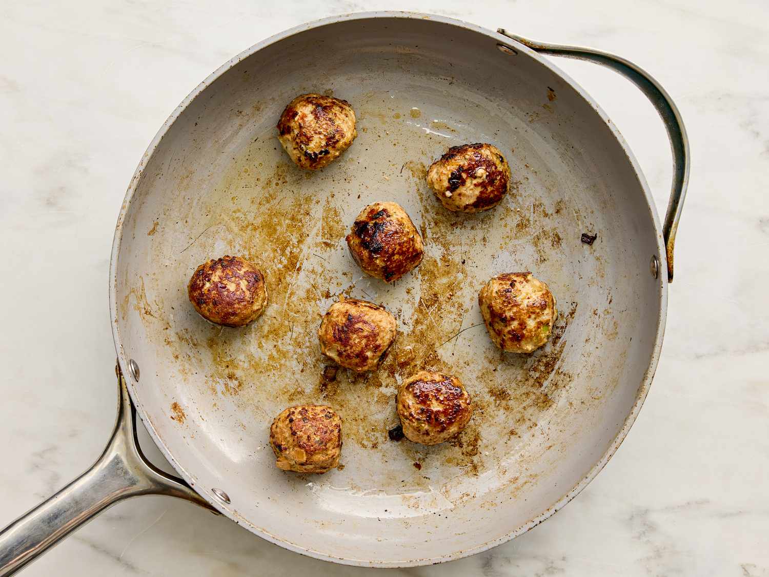 Cooked meatballs in a frying pan