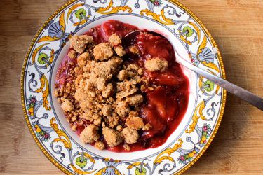 Overhead view of easy stovetop fruit crisp, served in a shallow bowl.