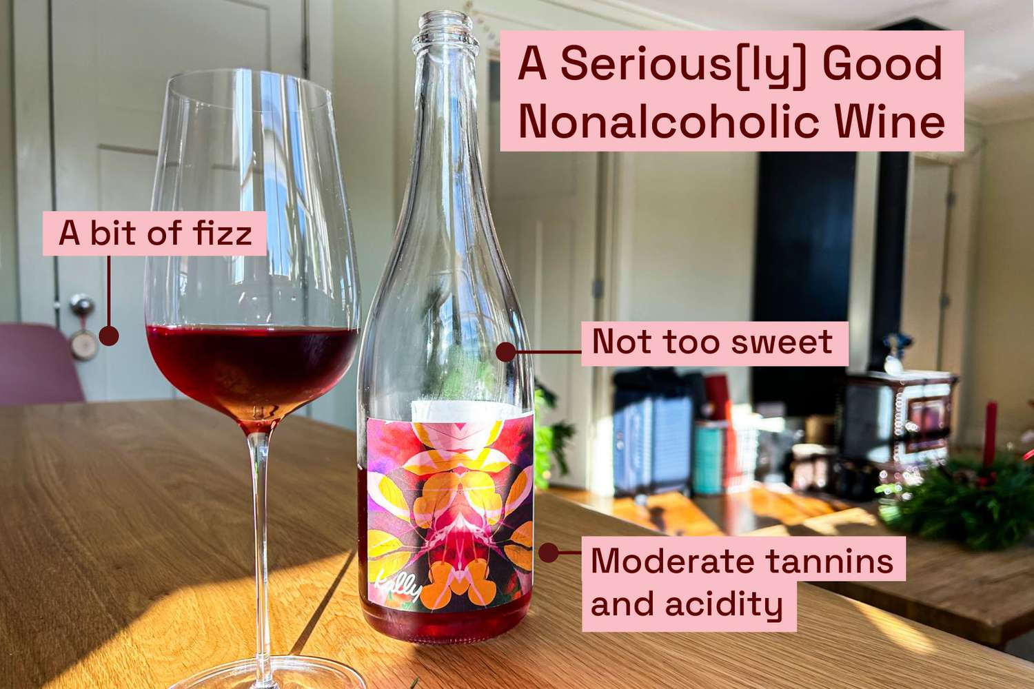 A bottle and glass of nonalcoholic red wine