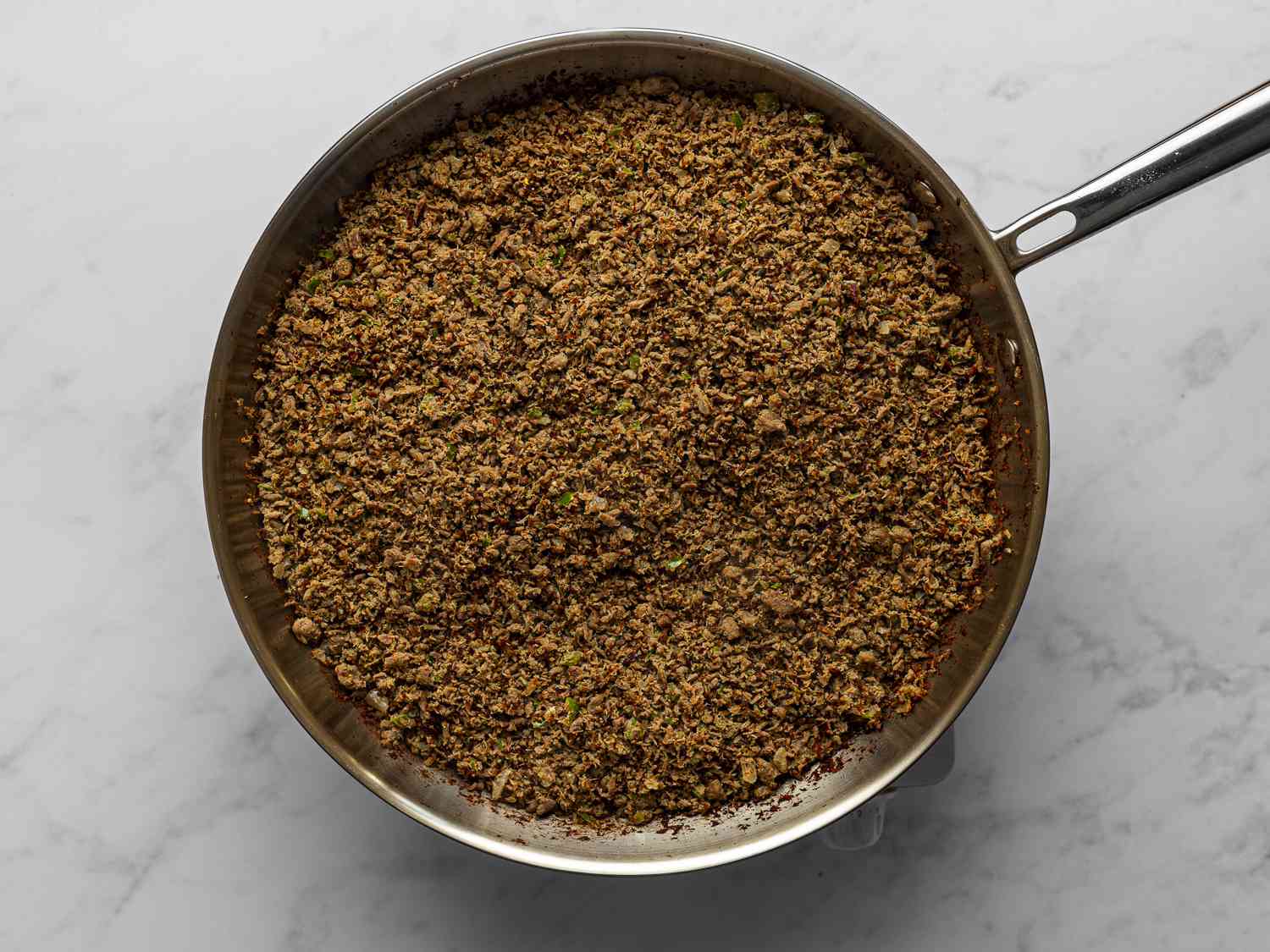 SalpicÃ³n slightly browned inside a large skillet.