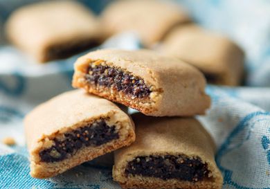 Homemade Fig Newtons on a kitchen towel