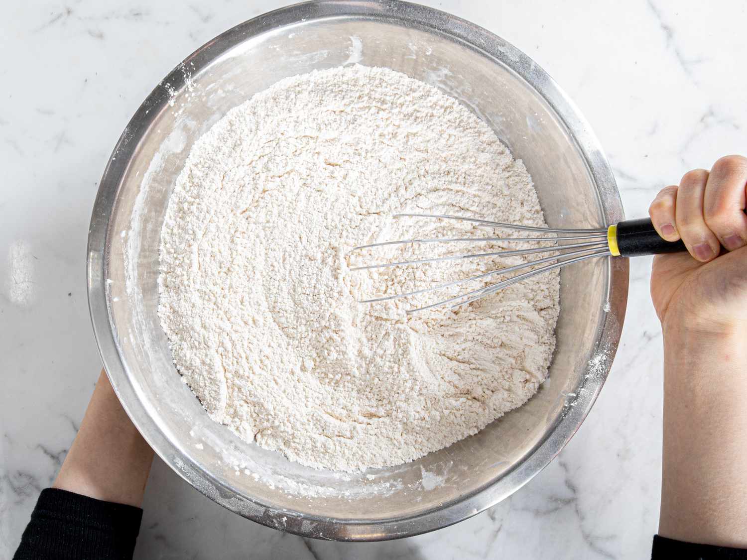 Overhead view of whisking dry ingredients together