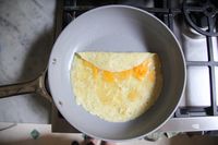 Food cooking in the Caraway Nonstick Ceramic Frying Pan