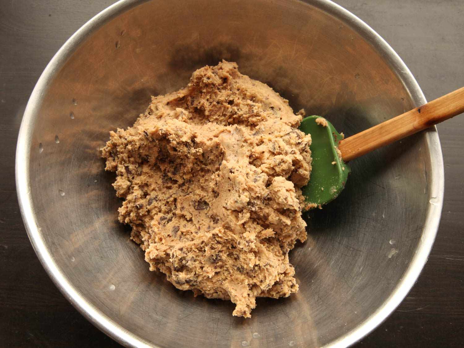 Bowl of cookie dough made by barely mixing in the flour