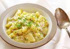 Serving bowl of Austrian potato salad (Erdapfelsalat).