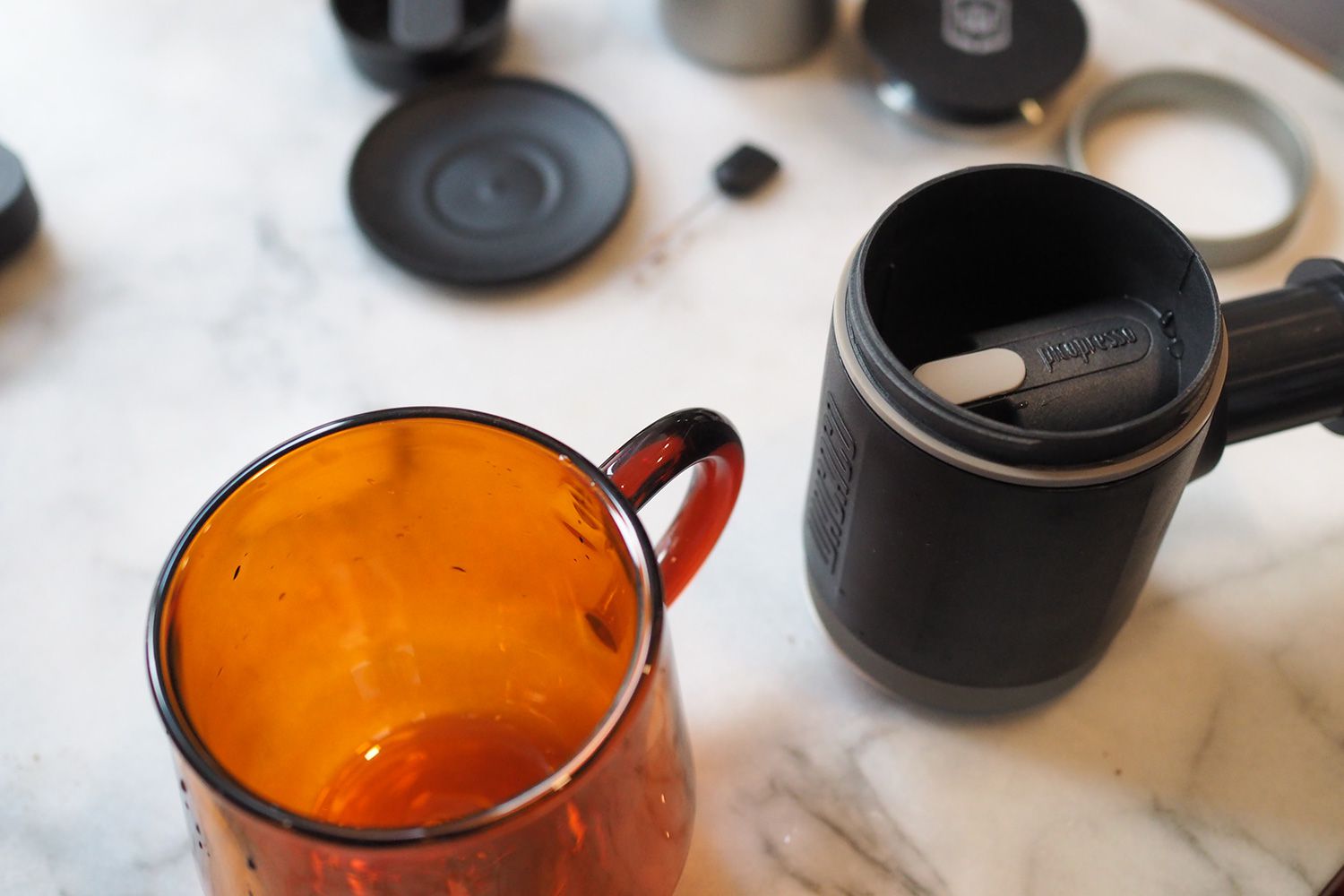 orange glass mug and thermal cup