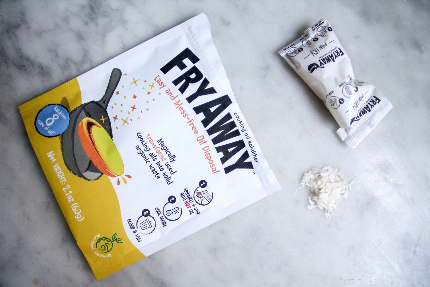 A packet of FryAway Pan Fry Cooking Oil Solidifier on a marbled surface