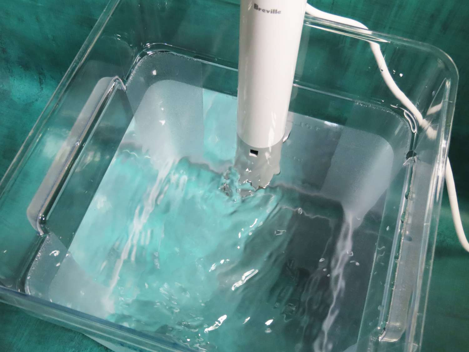 A look at a sous vide machine heating water in a cambro container.