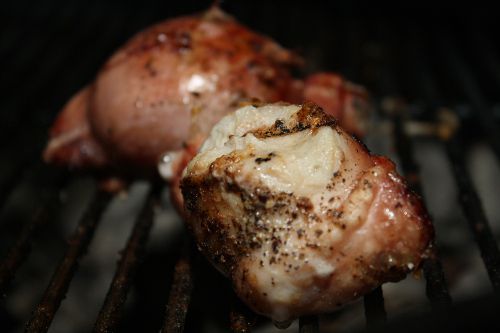 Closeup of browned testicles on the grill.