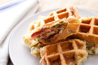 Cross-section pieces of mortadella layered in garlic puff-pastry waffle