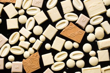 Collage of white chocolate pieces 