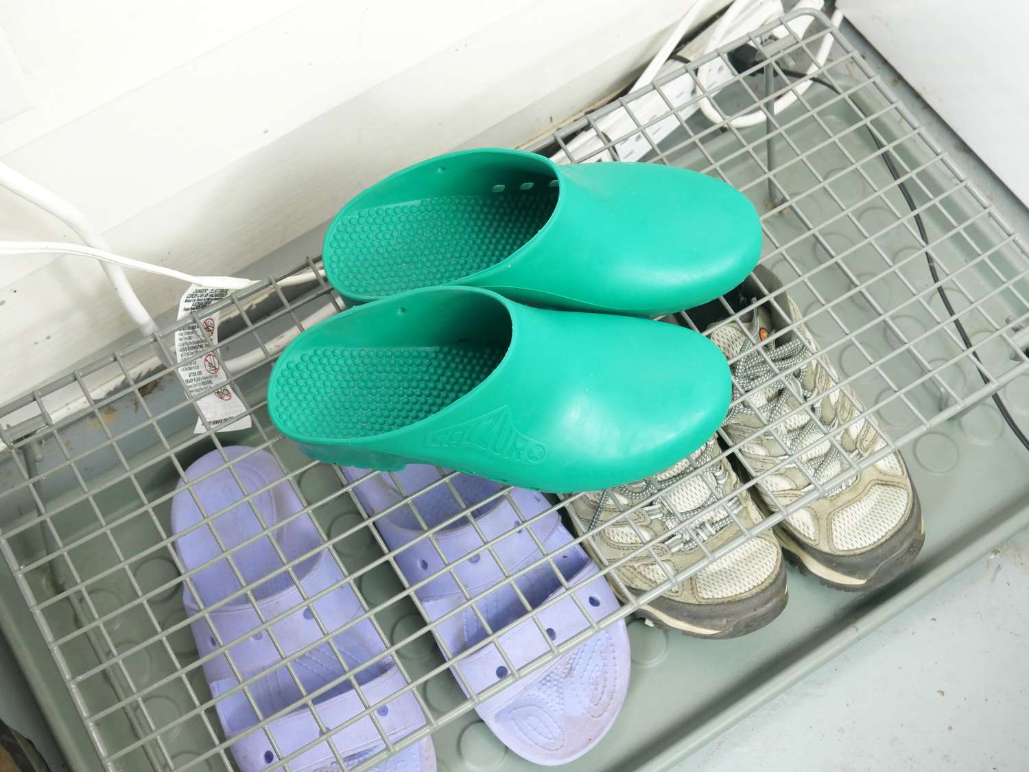 Calzuro clogs on a wire shoe rack.