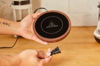 Person holding Sweetful Coffee Mug Warmer