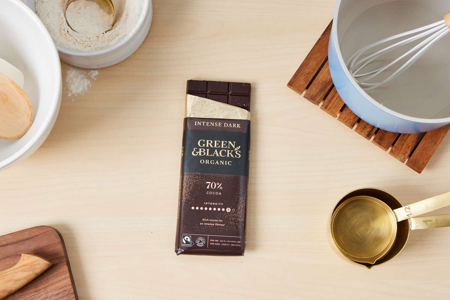 A partially unwrapped Green & Black chocolate bar.