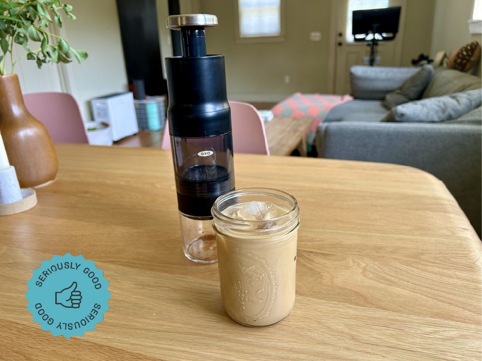 The OXO Rapid Brewer next to a cup of iced coffee on a kitchen table