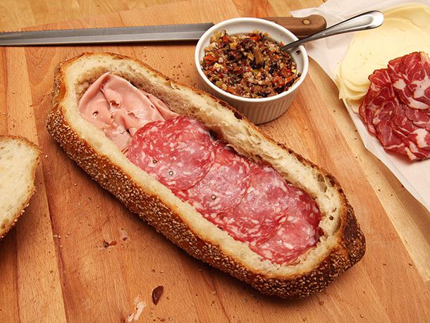mortadella and sopressata layered inside crusty loaf