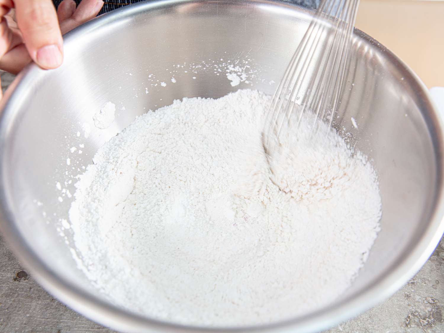 Overhead view of mixing flour coating.