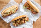 Shrimp, Oyster, and Fish Po' Boy sandwiches on sandwich paper